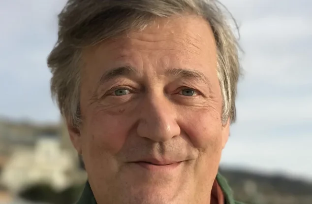 Close up of actor Stephen fry smiling kindly